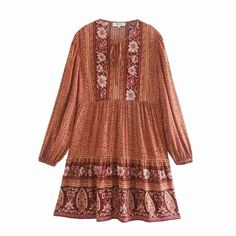 This dress is the perfect Fall staple. Pair with a jean jacket or sweater and knee-high boots for a cute breezy boho vibe. Mini length pull-over dress with billowy sleeves and loose and flowy silhouette. Tassel tie at chest. Dress has all-over floral pattern. Bump friendly. Wash cold, gentle cycle. Available in Sky Blue or Muted Burnt Orange. Women's sizes: S-L. Flattering cut for all body types. Fabric has no stretch, but is cut loose and flowy. Good things take time. Quicker shipping: This dre Fall Beach Dress With Lantern Sleeves, Spring Long Sleeve Hippie Mini Dress, Spring Hippie Long Sleeve Mini Dress, Hippie Long Sleeve Mini Dress For Spring, Flowy Long Sleeve Mini Dress For Fall, Spring Vacation Long Sleeve Peasant Dress, Bohemian Long Sleeve Dresses For Fall, Fall Bohemian Boho Dress For Vacation, Casual Boho Dress With Boho Print, Knee-length