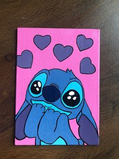 a painting of a blue cartoon character sitting on top of a pink background with hearts