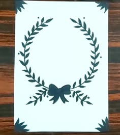 a piece of paper with a wreath on it