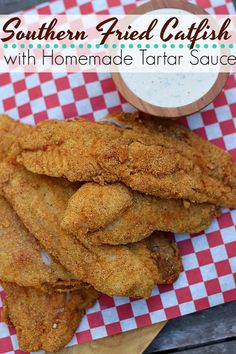 fried fish with homemade tartar sauce on a red and white checkered paper