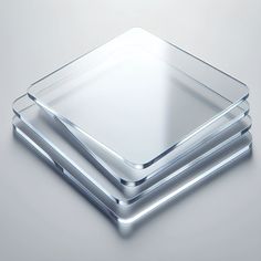 three square glass plates stacked on top of each other