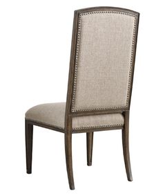 an upholstered dining chair with beige fabric and wood trimmings on the back