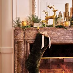 a christmas stocking hanging from a fireplace mantel