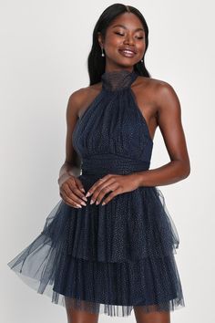 With your favorite heels and sparkling jewelry, you'll be ready to enchant everyone you meet in the Lulus Sweet Magic Navy Blue Glitter Tiered Tulle Halter Mini Dress! Fluffy sheer tulle, adorned with sparkling silver glitter throughout, shapes this adorable dress with a high, tying halter neckline that supports a gathered bodice. Banded, gathered waist sits atop a tiered skirt that ends at a flirty mini hem. Hidden back zipper/clasp. Fit: This garment fits true to size. Length: Mid-thigh. Size Winter Ball Dresses, Short Hoco Dresses, Sweet Magic, Halter Dress Short, Sparkling Jewelry, Tulle Mini Dress, Gathered Bodice, Glitter Dress, Halter Mini Dress