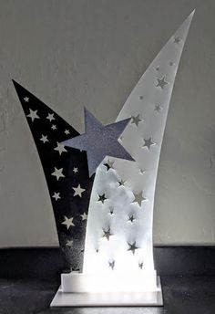 a white and black sculpture with stars on it