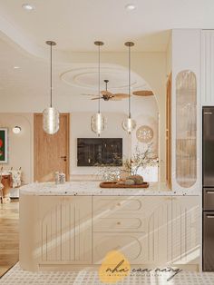 a large kitchen with an island in the middle and lots of lights hanging from the ceiling