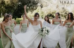 the bride and her bridesmaids are all dressed in green