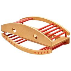 a wooden toy sled with red handles