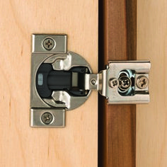 an open cabinet door with a latch on the front and side panels that are made out of wood