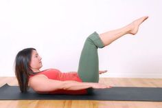 a woman doing an exercise on a yoga mat