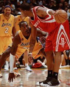 the basketball players are playing on the court