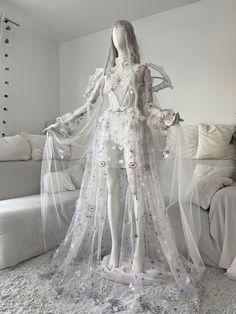 Fashion designer and tailor: Askasu. Handmade unique costume/dress, single art-pieces. Soft tulle, elastic mesh and strips, embordiery, soft boning, crystals, glass beads, metal chains and elements, lace, acryl birds, chiffon hand sewn flowers, sequin fabric. Air Prism Fae Gown Price: 1700 USD (1) Bust: 86-96 cm (33.9-37.8 inch) (2) Under bust: 74-84 cm (29.1-33.1 inch) (3) Waist: 65-75 cm (25.6-29.5 inch) (4) Hip (widest): 91-97 cm (35.8-38.2 inch) (7) Shoulders width: 30-45 cm (11.8-17.7 inch) Rain Fairy Costume, White Fairy Costume Halloween, Air Costume Element, Air Element Costume, Fae Gown, Air Costume, Ethereal Costume, Fae Dress Gowns, Fae Fashion