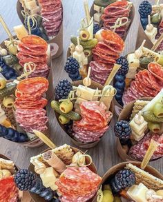 an assortment of finger foods arranged in bowls