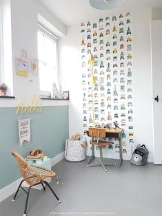 a child's room with wallpaper and toys