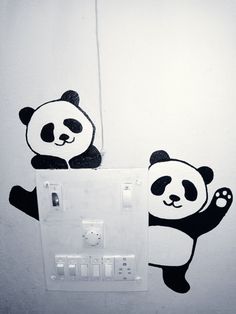 there is a panda bear on the light switch