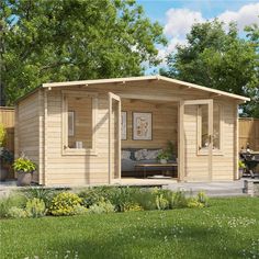 a small wooden cabin sitting on top of a lush green field