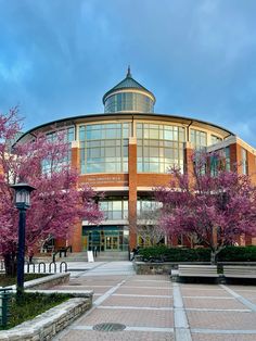 a large building with trees in front of it