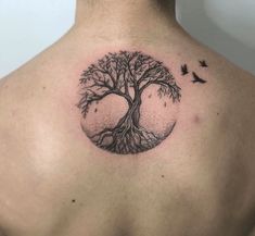 a man with a tree tattoo on his back