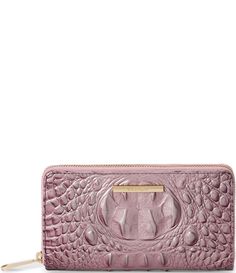 From the Melbourne Collection by BRAHMIN&#x2C; the Mellow Rose Suri Wallet features: Crocodile-embossed leatherGold-tone hardwareZip-around closure12 card slots&#x2C; ID slot&#x2C; 2 bill slots&#x2C; and zip pocket insideBack zip pocket outsideApprox. 4.25" H x 7.5" LApprox. weight 0.5 lb. Imported. Due to the nature of the materials used&#x2C; each Brahmin product is one-of-a-kind. Vari Dillard's, Embossed Leather, Inside Pocket, Card Slots, Slots, Melbourne, Zip Pockets, Wallet, Handbags