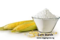 corn on the cob and sugar in a glass bowl next to an ear of corn