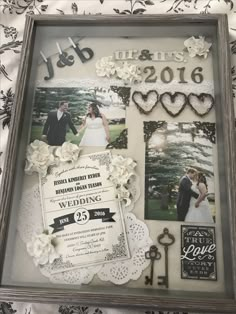 a wedding photo frame with flowers and hearts on it, surrounded by other items from the couple's wedding day