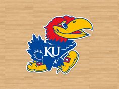 the kansas jays logo is shown on a basketball court with wood flooring in the background