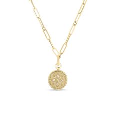 Designed by Roberto Coin in glowing 18k yellow gold, evolves this medallion pendant from the Venetian Princess Collection. This Pendant set on a timeless paperclip chain will have you feeling like a million bucks. The delicate rope detail on the edge, satin finish surface, radiating round diamonds, and the princess flower motif all come together to give you a luminous look for your next event. 18k Yellow Gold 0.06ctw Diamonds Medallion Pendant Paperclip Chain 20" Length Venetian Princess Collect Roberto Coin Jewelry, Princess Necklace, The Venetian, Princess Collection, Roberto Coin, Bezel Pendant, Medallion Necklace, Gold Coins, Pendant Set