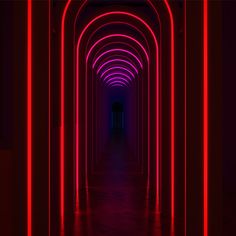 a long tunnel with red and purple lights