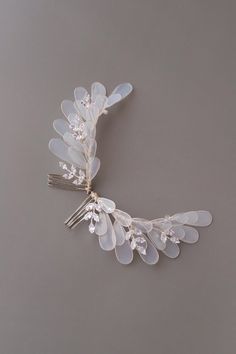 Bridal hair piece, Feather wedding hair piece, Veil hair piece, Side hair comb, Bride hair comb, Wedding hair comb silver, Bridal veil comb Our pretty and elegant angel hair pieces are perfect choice for a modern bride. The hair pieces are made of UV resin, that is the new trend in handmade jewelry. Each petal is created manually. The comb is finished with white Czech beads, Cubic zirconia rhinestones with silver rhodium plated wire to enhance its design and shape  You can purchase one or two hairpieces! - Available in gold/rose gold and silver-tone. - The color and size of flowers we can make according to your preferences. - Suits a range of hairstyles - Measurements approx.: 4.33 inches (11 cm) - Comes in a beautiful signature box! Custom orders are welcome! Feel free to contact us!! Ple Unique Bridal Hair Comb, Shenandoah Wedding, Veil Hair Piece, Bride Hair Comb, Feather Hair Pieces, Veil Hair, Veil Comb, Comb Veil, Flower Hair Accessories Wedding