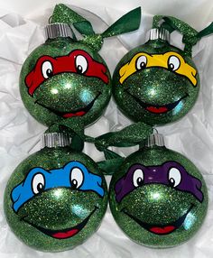 four teenaged turtles painted on christmas ornaments