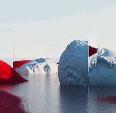 an iceberg floating on top of a body of water next to red and white rocks