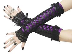 Gothic gloves are a stylish and edgy accessory that can add a touch of drama to any outfit. Typically made from materials like lace, or velvet, gothic gloves often feature intricate designs, such as studs, or intricate embroidery. Perfect for completing a gothic-inspired look or adding a touch of mystery to a more traditional outfit, gothic gloves are a versatile accessory that can elevate any ensemble. long fingerless gloves for womens, evening gloves in gothic, burlesque, vintage or bohemian s Purple Gloves, Long Fingerless Gloves, Evening Gloves, Edgy Accessories, Purple Ribbon