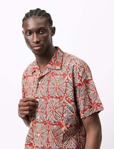 Transform your wardrobe with the beams plus open collar block print shirt - vermillion red. this shirt's lightweight cotton fabric is uniquely crafted using traditional indian woodblock printing techniques giving it a charming and natural appearance. as you wear and wash this shirt its natural plant dyes and minerals will continue to fade and age adding character to the garment.    drawing inspiration from classic american shirting from the 1960's beams combines japanese refinement with an ivy league spirit in its production. this shirt features an open camp collar dual chest pockets and mother of pearl buttons to complete its one-of-a-kind design.    article fit & features —    — material: 100% cotton  — regular fit take your usual size  — five button placket  — relaxed camp collar  — sin Relaxed Fit Red Printed Hawaiian Shirt, Red Printed Hawaiian Shirt With Relaxed Fit, Red Printed Hawaiian Shirt Relaxed Fit, Red Cotton Shirt With Camp Collar, Red Relaxed Fit Graphic Print Camp Shirt, Red Graphic Print Shirt With Camp Collar, Red Printed Tops With Camp Collar, Red Printed Top With Camp Collar, Red Camp Collar Shirt With Graphic Print