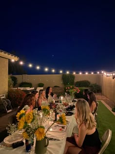 a group of people sitting at a dinner table