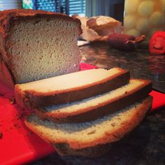 a loaf of bread sitting on top of a red cutting board