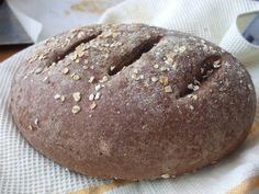 a loaf of bread sitting on top of a napkin