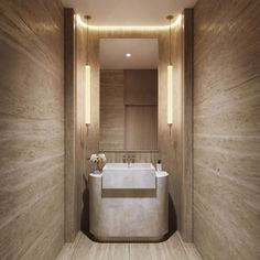 a bathroom with a sink, mirror and lights on the wall next to each other