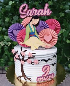 a birthday cake decorated with an image of snow white and the seven dwarfs on top