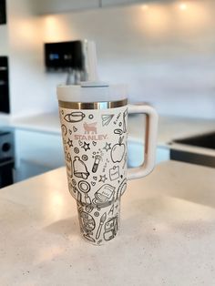 a cup sitting on top of a kitchen counter