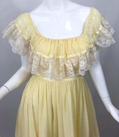 For Sale on 1stDibs - Amazing 1970s pale yellow and white cotton voile and lace boho empire maxi dress! Features white lace around the bodice and at the ruffle hem. Can be worn Dress Alterations Diy, Homecoming Dresses Yellow, Brown Prom Dresses, Champagne Homecoming Dresses, Yellow Homecoming Dresses, 70s Prairie, Put Me In Coach, Prairie Dresses, Burgundy Homecoming Dresses