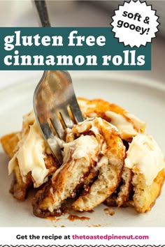 a close up of a plate of food with a fork in it and the text gluten free cinnamon rolls