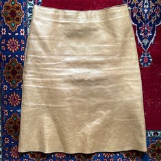 Authentic Rare Vivienne Tam Gold Metallic Genuine Leather Mid Length Skirt From The Fall 2000 Runway Collection. Vivienne Tam Size 1 Which Is A Us Small. Lined. Side Zipper. Outstanding Condition. Length 22” Waist Flat Across 14.5” Hips Flat Across 19”.