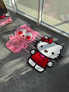 hello kitty rugs on the floor in front of a window with an image of a skeleton