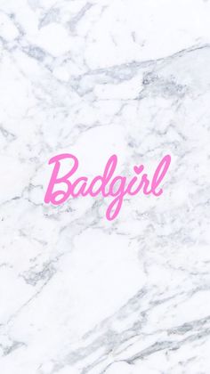 the word badgirl is written in pink on a marble surface