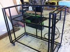 the metal frame is being assembled to be used as a shelf for various items and other things