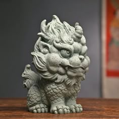 a statue of a dragon on a table