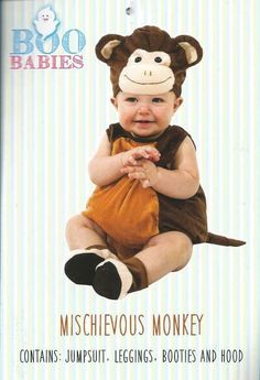 a baby wearing a monkey costume sitting in front of a sign that says boo babies