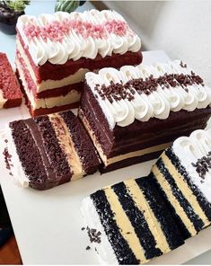 several different types of cakes on a table