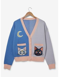 a blue cardigan with two cats on the front and one cat on the back