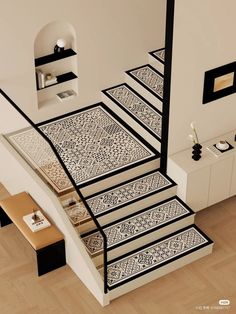 the stairs are decorated with black and white designs